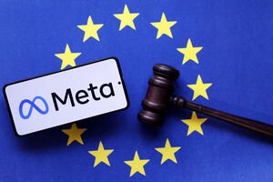 téléphone avec META affiché dessus avec le drapeau de l'UE en fond